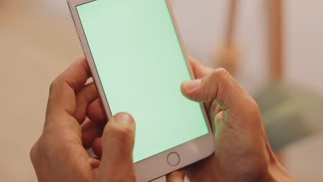 Man-checking-message-on-a-smartphone