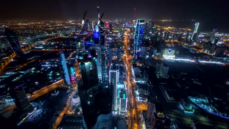 Skyline-with-Skyscrapers-night-timelapse-in-Kuwait-City-downtown-illuminated-at-dusk.-Kuwait-City,-Middle-East