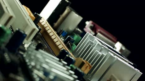 Close-up-of-an-aluminum-heatsink-mounted-on-a-green-computer-circuit-board