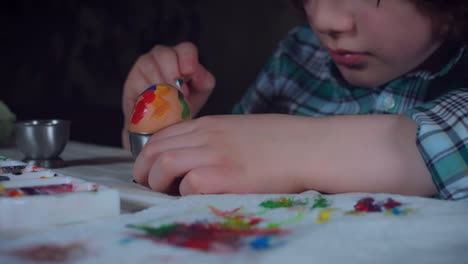 4K-Home-Shot-Of-Child-Painting-Easter-Eggs