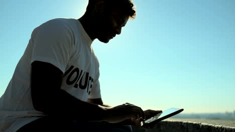 Low-angle-of-a-concentrated-volunteer-using-the-tablet