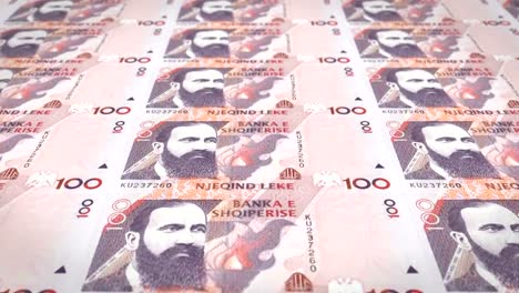 Banknotes-of-one-hundred-albanian-lek-of-Albany-rolling,-cash-money,-loop