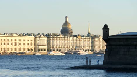 People-stand-on-a-coast-of-Peter-and-Paul-Fortress---St.-Petersburg,-Russia