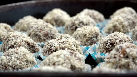 Chocolate-coconut-candy-balls,-closeup-dolly-shot-background