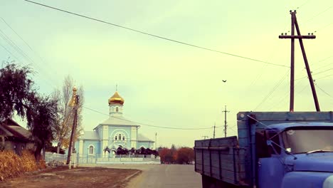 Village-street-view-with-church-and-truck