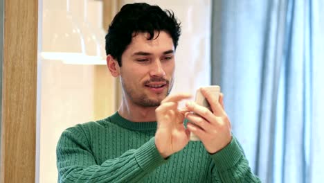 Young-Afro-American-Man-Browsing-Online-on-Smartphone