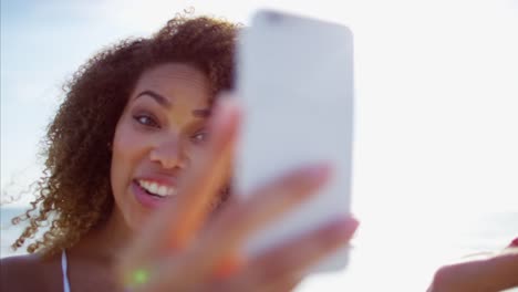 African-American-female-on-beach-vacation-at-sunset