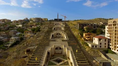 Drone-flying-over-famous-Cafesijian-museum-of-Art-and-the-Cascade,-traveling