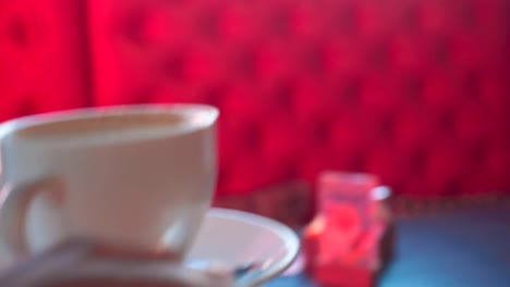 Steadicam-establish-shot-woman-waiter-hands-bring-cup-of-hot-delicious-coffee-in-cafe-close-up