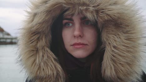 Closeup-portrait-of-a-young-beautiful-red-haired-woman-outdoors.-Girl-in-a-warm-fluffy-jacket