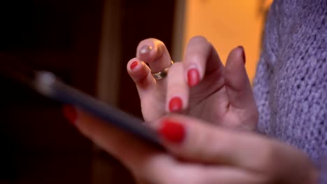 Closeup-shoot-of-female-hands-typing-on-the-tablet-at-cozy-home-indoors