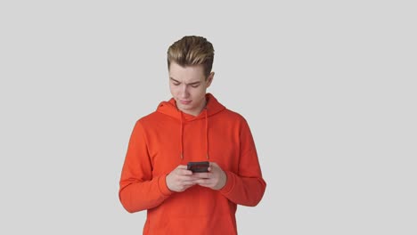 Man-text-messaging-on-mobile-phone-against-white-background