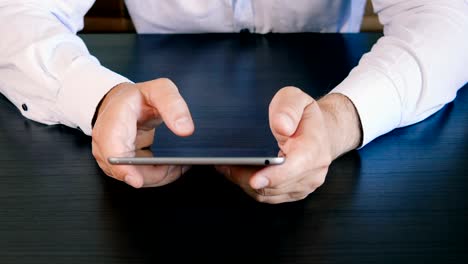 Man-hands-using-tablet-computer