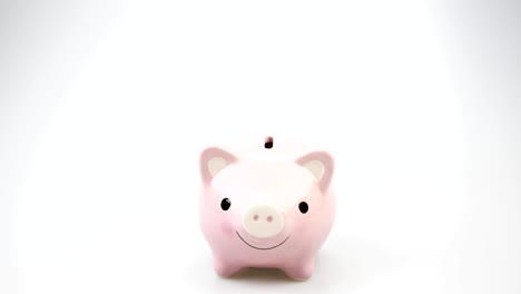 piggy-bank-business-standing-on-a-pile-of-coins-concept.-saving-money-is-an-investment-for-the-future.-Banking-investment-and