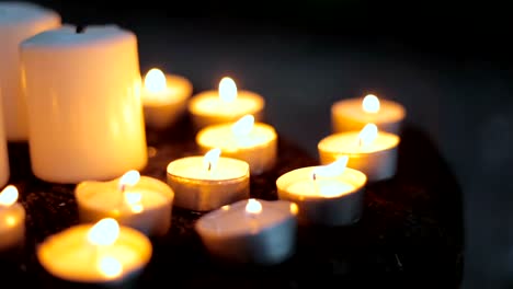 Tea-light-candles-being-blown-out