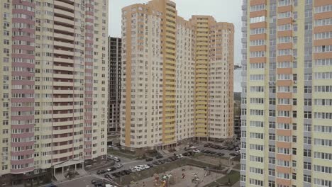 Aerial-view.-A-complex-of-new-high-rise-apartment-buildings-in-the-city.-Camera-goes-up