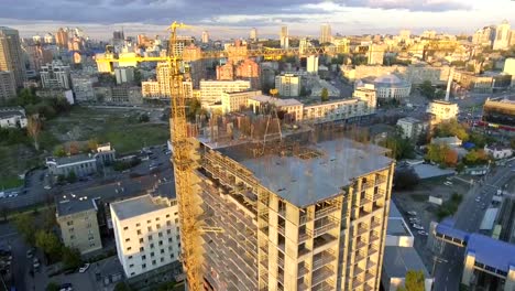 Industry-construction-and-development.-Workers-building-a-new-house.Aerial-shot.The-camera-moves-from-the-top-down