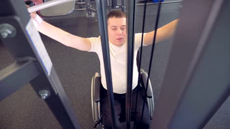 Strength-of-weak-hands-muscles-by-disabled-man-in-a-wheelchair.