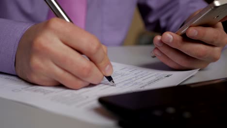 Man-filling-US-tax-form.-tax-form-us-business-income-office-hand-fill-concept.-Closeup.--Man-Is-Checking-The-Box-Of-Filing-Status-In-The-US-Individual-Income.--Tax-Return-Form-1040