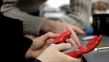 Close-up-of-two-people-discussing-bionic-hand