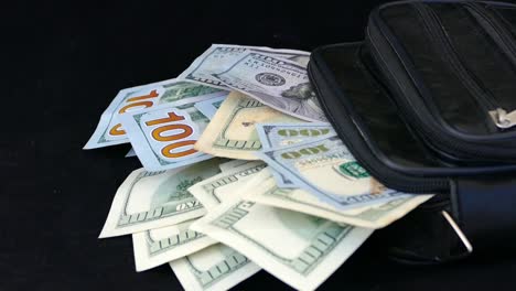 a-lot-of-money-in-the-hand-bag-100-dollars,