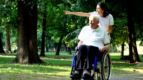 Granddaughter,-nurse,-caring-for-the-elderly,-girl-(woman),-grandfather,-happy,-freedom,-running-around-in-the-park.