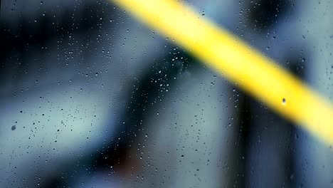 View-of-hungarian-flag-through-rain-drops-on-window