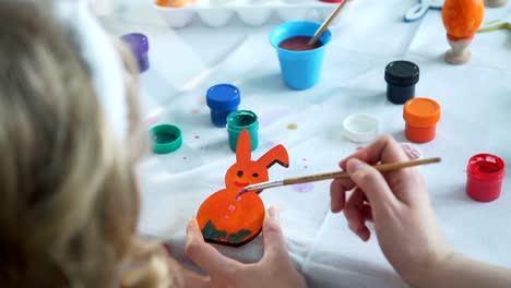 Woman-Painting-Wooden-Easter-Bunny-with-Daughter