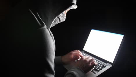 Anonymous-Hooded-Hacker-Programming-in-Computer-Console-Breaking-Password