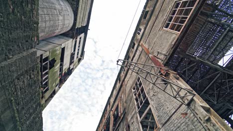 Old-abandoned-plant-with-broken-windows-ruined-after-the-military-actions.