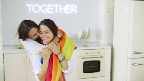 Girlfriends-have-fun-with-rainbow-flag