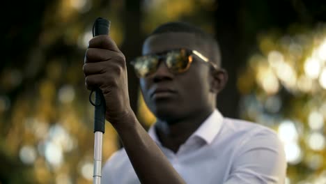 Blind-black-african-man-in-the-park.blind,-blindness,Visually-impaired