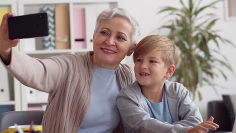 Attractive-Grandmother-Making-Selfie-with-Grandson