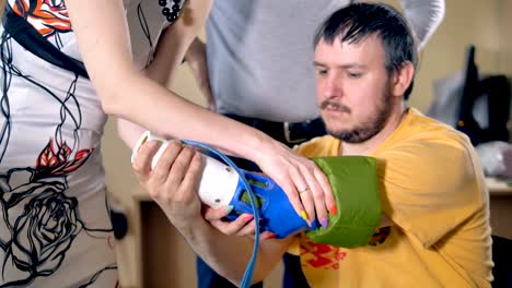 Setting-artificial-limb-on-the-amputated-hand.