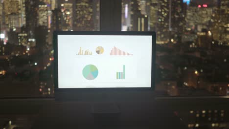 Computer-Screen-with-Business-Chart-and-Cityscape-Background.-Start-Up-Enterprise-Work-Growth-Financial-Industry-Success