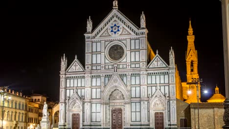 Tourists-on-Piazza-di-Santa-Croce-at-night-timelapse-with-Basilica-di-Santa-Croce-Basilica-of-the-Holy-Cross-in-Florence-city