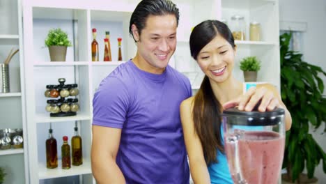 Healthy-lifestyle-Ethnic-couple-making-organic-fruit-smoothie