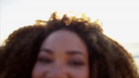 Portrait-of-African-American-female-on-beach-vacation