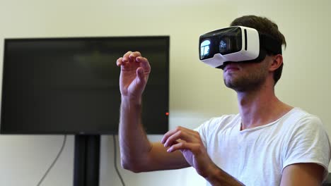 young-man-Using-3D-Virtual-Reality-Headset-Vr-Glasses-in-office.