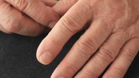 Closeup-of-man-with-finger-tremor