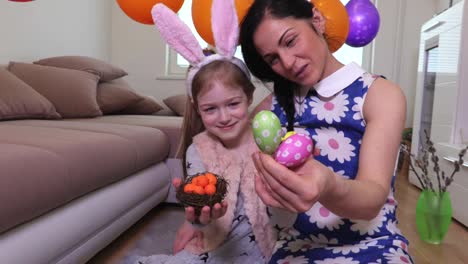 Mother-and-daughter-with-decorative-Easter-eggs