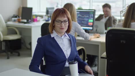 Positive-Paraplegic-Businesswoman-Riding-Wheelchair-into-Office