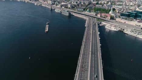 4K-Aerial-drone-fooage.-Marathon-running-on-the-bridge.-Wide-shot.