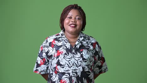 Overweight-beautiful-African-woman-against-green-background