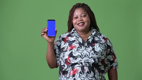 Overweight-beautiful-African-woman-against-green-background