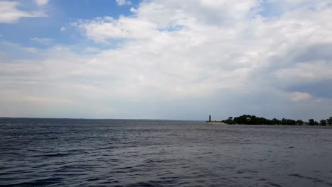 Cityscape-and-skyline-in-cloudy-sky-and-river.-Sunshine,-blue-sky.-Mysterious-clouds-are-flying-very-low-over-river.