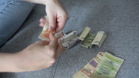 Anonymous-woman-counting-old-paper-money