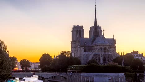 Rear-view-of-Notre-Dame-De-Paris-cathedral-day-to-night-timelapse-after-sunset