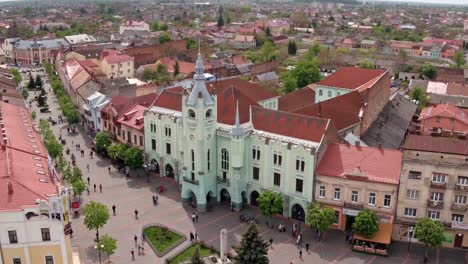 Aerial-view-Peace-Square-of-Mukachevo.-Nearby-is-the-Gothic-chapel-of-St.-Joseph,-city-hall-і-Cathedral-Church-of-St.-Martine.-Eastern-Carpathian-mountains.-Ukraine