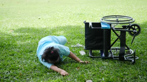 Elderly-woman-patient-want-to-help-after-wheelchair-overturned-in-the-ground